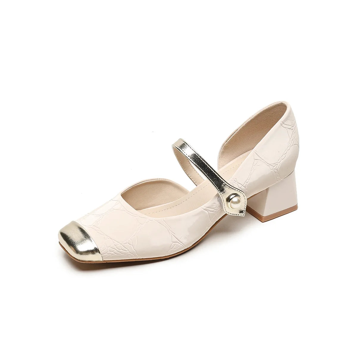Beige shoe with metallic strap on a white background