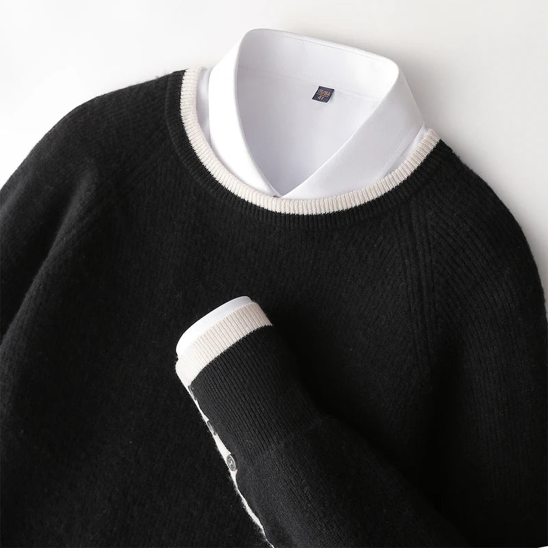 Black sweater over a white shirt on a mannequin with a visible brand label.