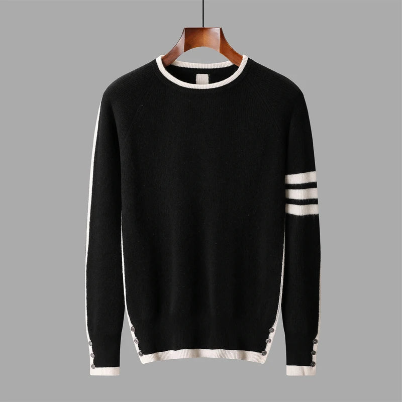 Black sweater with white trim on a gray background
