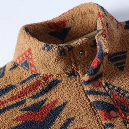 Close-up of a patterned jacket with geometric designs on a white background