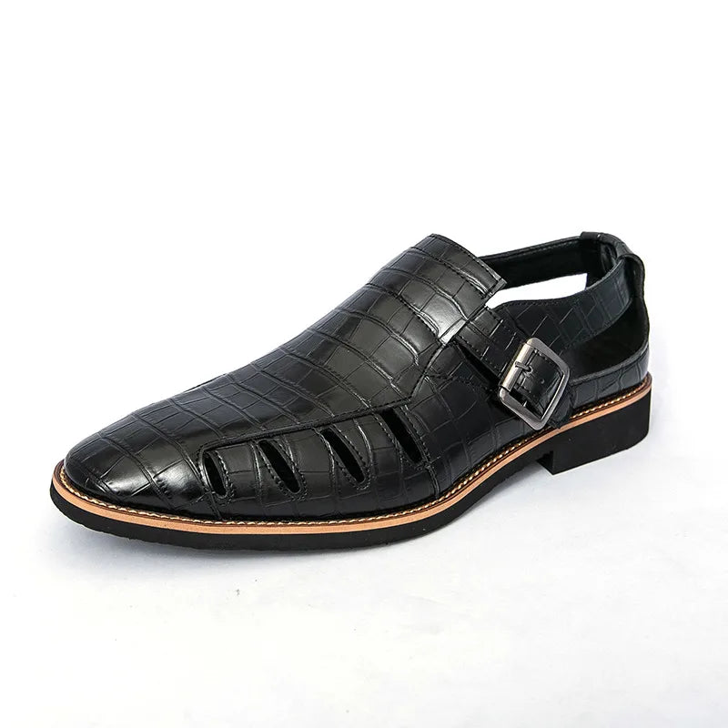 Black sandal with a buckle on a white background