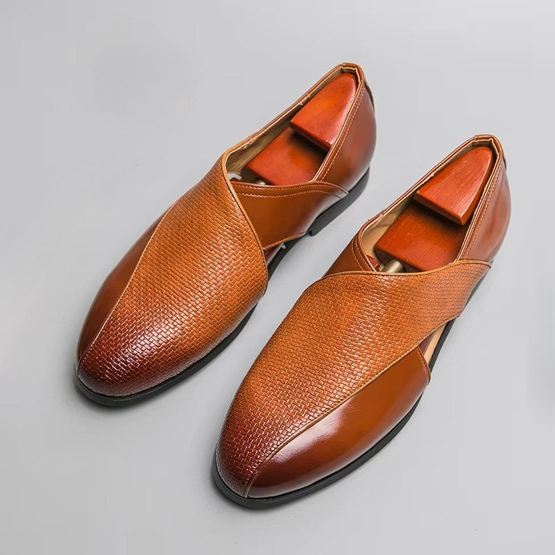 Pair of brown leather shoes on a light gray background