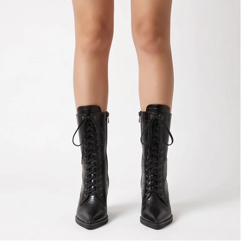 Model wearing Black Briarwood Croc-Embossed Lace-Up Boots in studio
