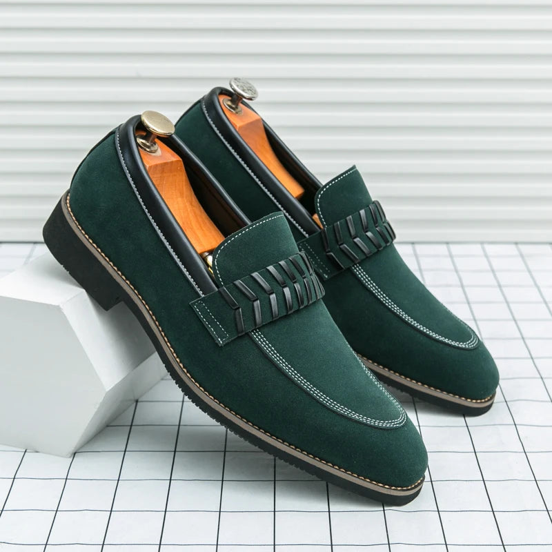 Green loafers with decorative elements on a grid background