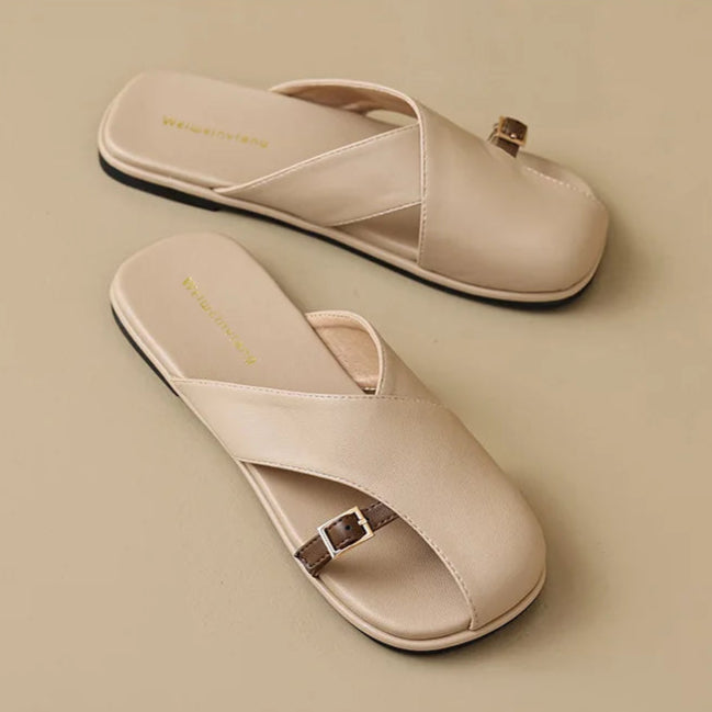 Beige sandals shown from multiple angles on a beige background