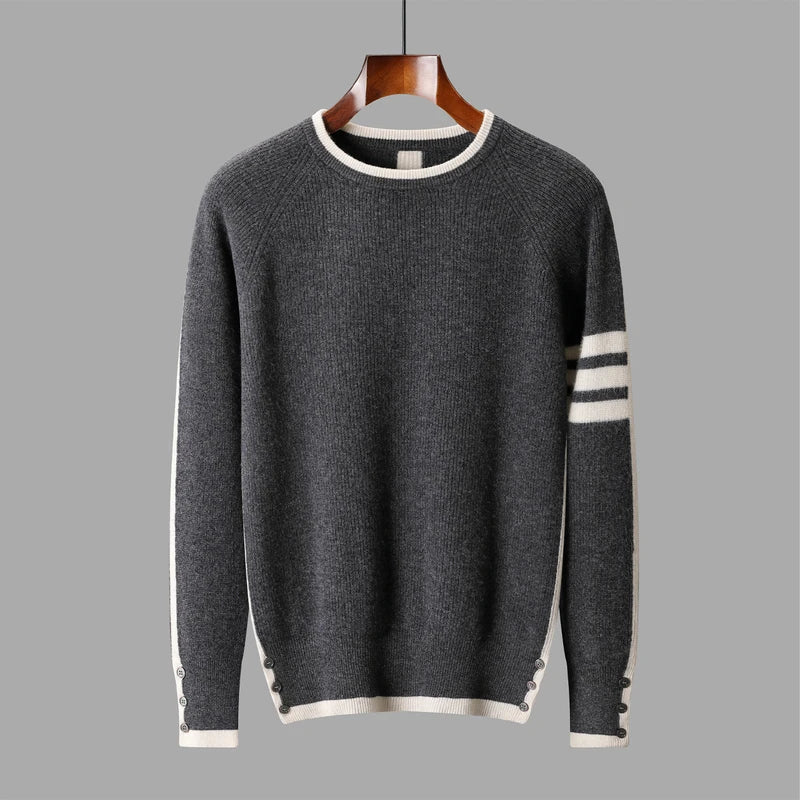 Gray sweater with white trim on a hanger against a gray background