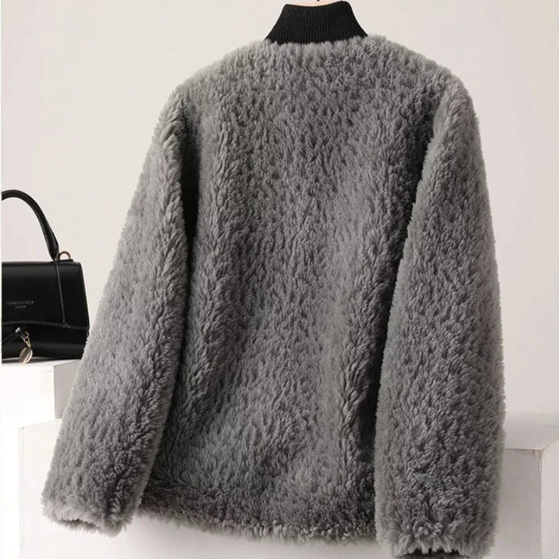 Gray fluffy cardigan on a mannequin against a white background