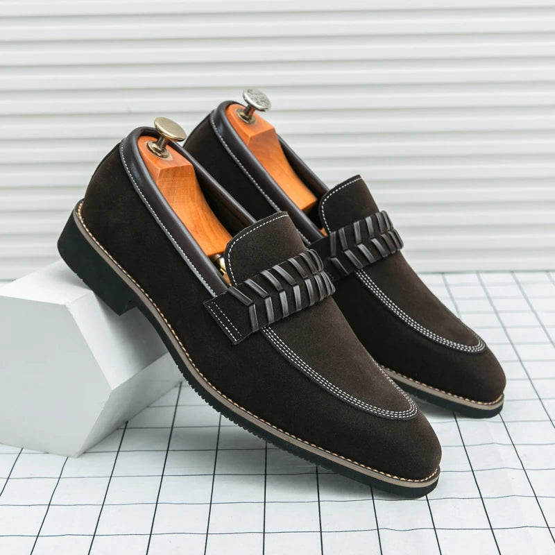 Brown suede loafers with striped detail on a white and gray checkered background