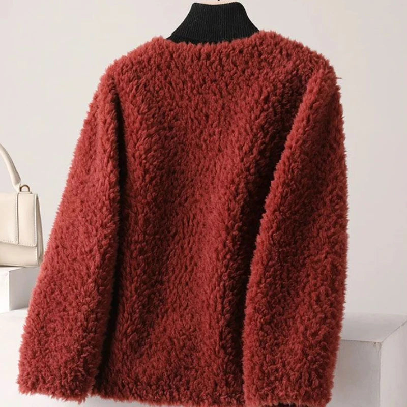 Red fluffy sweater on a mannequin against a white background