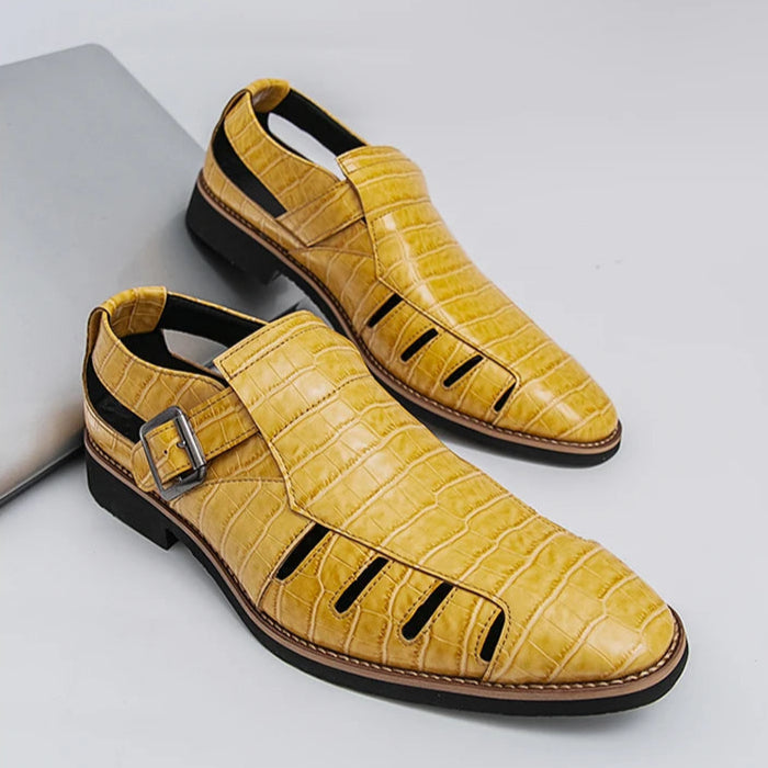 Yellow sandals with a textured pattern on a gray background