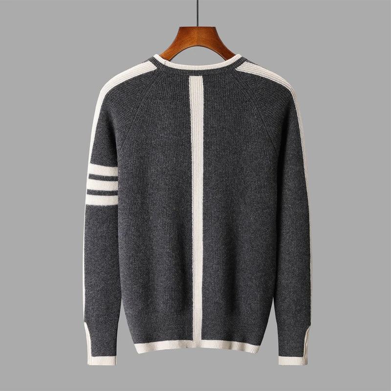 Gray sweater with white stripes on a hanger against a gray background