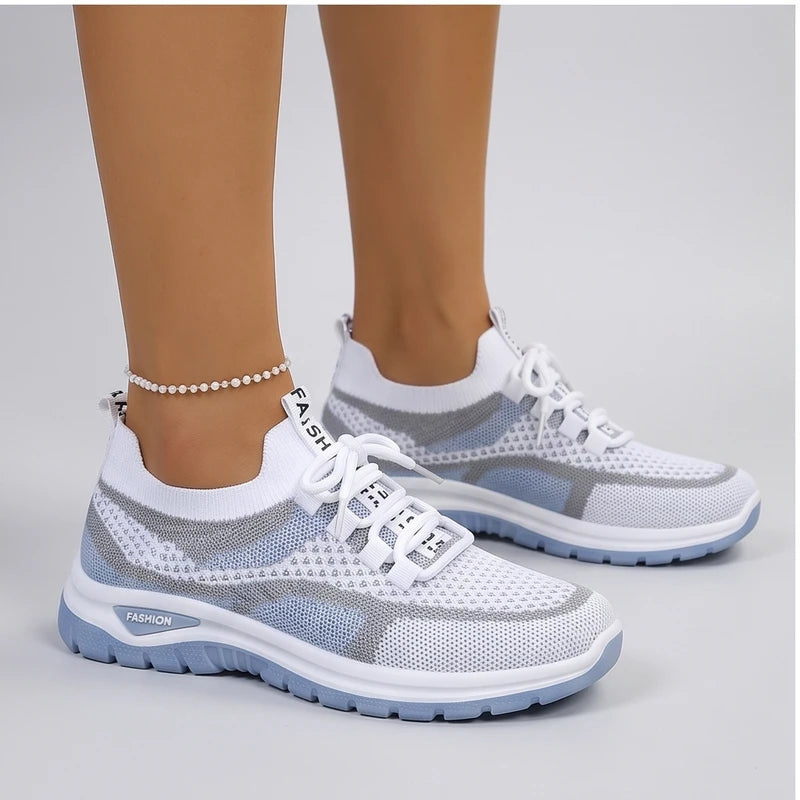 Model wearing Blue Kesslyn Mesh Running Sneakers in studio - 2