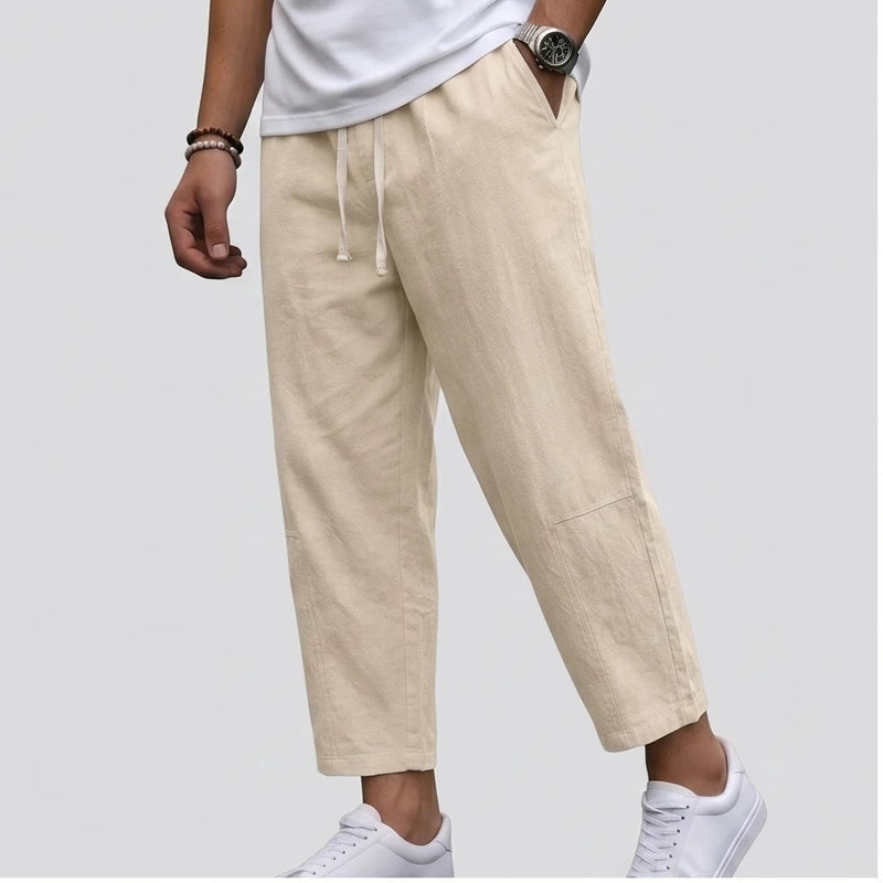 Model wearing Beige Raymond - Men’s Drawstring Relaxed Linen Pants in studio