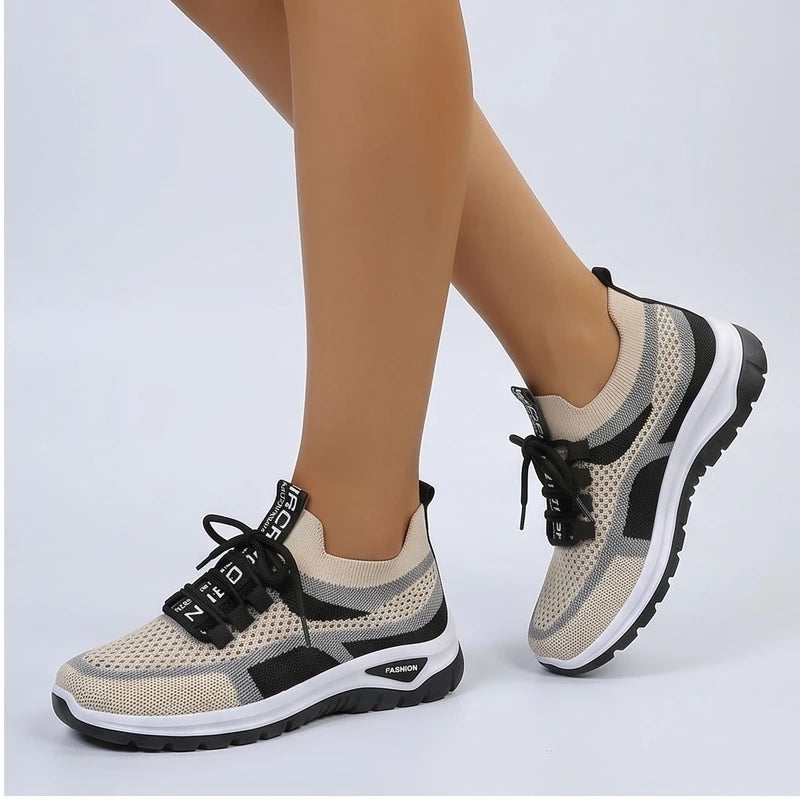 Model wearing Black Kesslyn Mesh Running Sneakers in studio