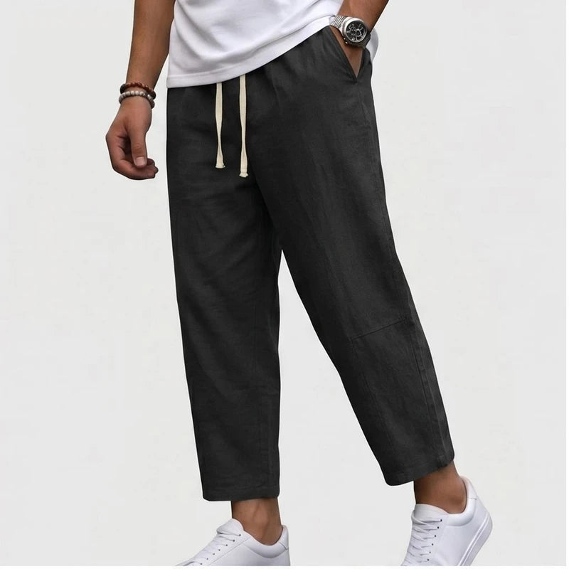 Model wearing Black Raymond - Men’s Drawstring Relaxed Linen Pants in studio