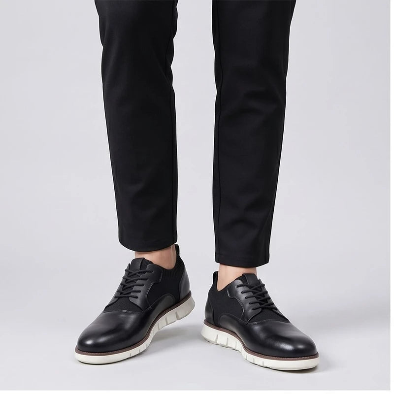 Model wearing Black leather oxford in a studio