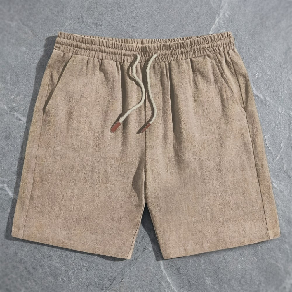 Beige linen drawstring shorts with a relaxed fit and adjustable tie.